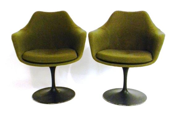 Appraisal: Two black Eero Saarinen armchairs swivel seat molded aluminum base