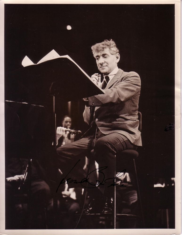 Appraisal: BERNSTEIN LEONARD Photograph Signed showing him sitting behind a music