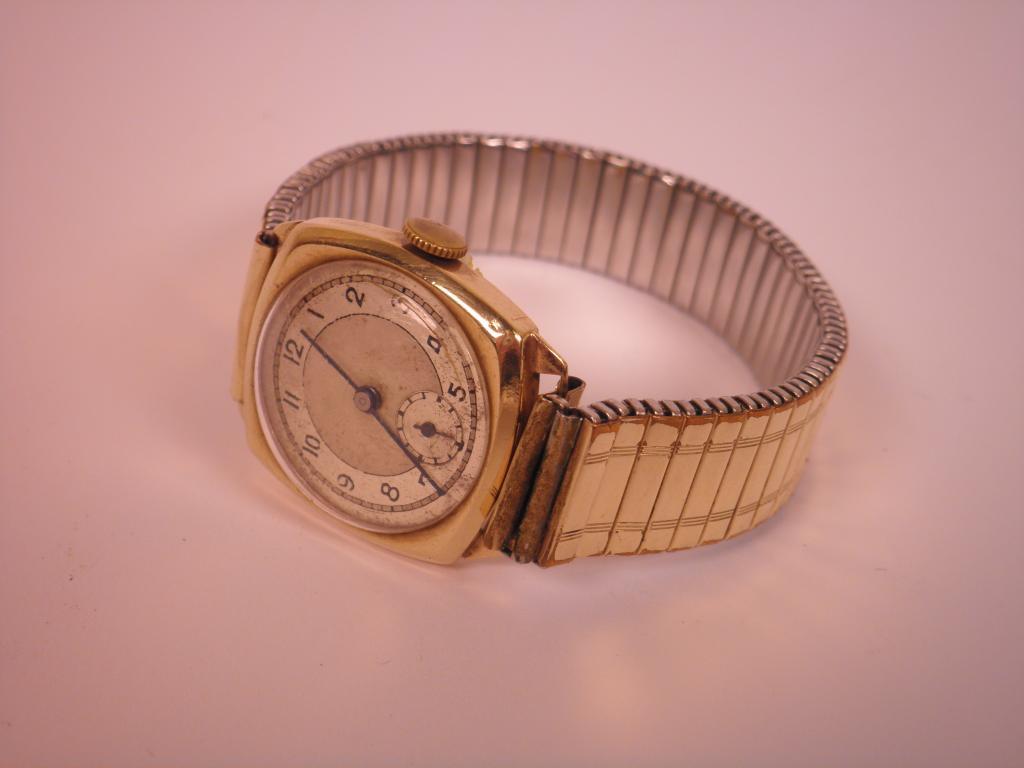 Appraisal: A 's gold gent's wrist watch with articulate strap