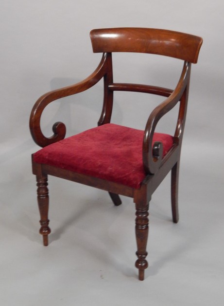 Appraisal: A Victorian mahogany open armchair with a drop in seat