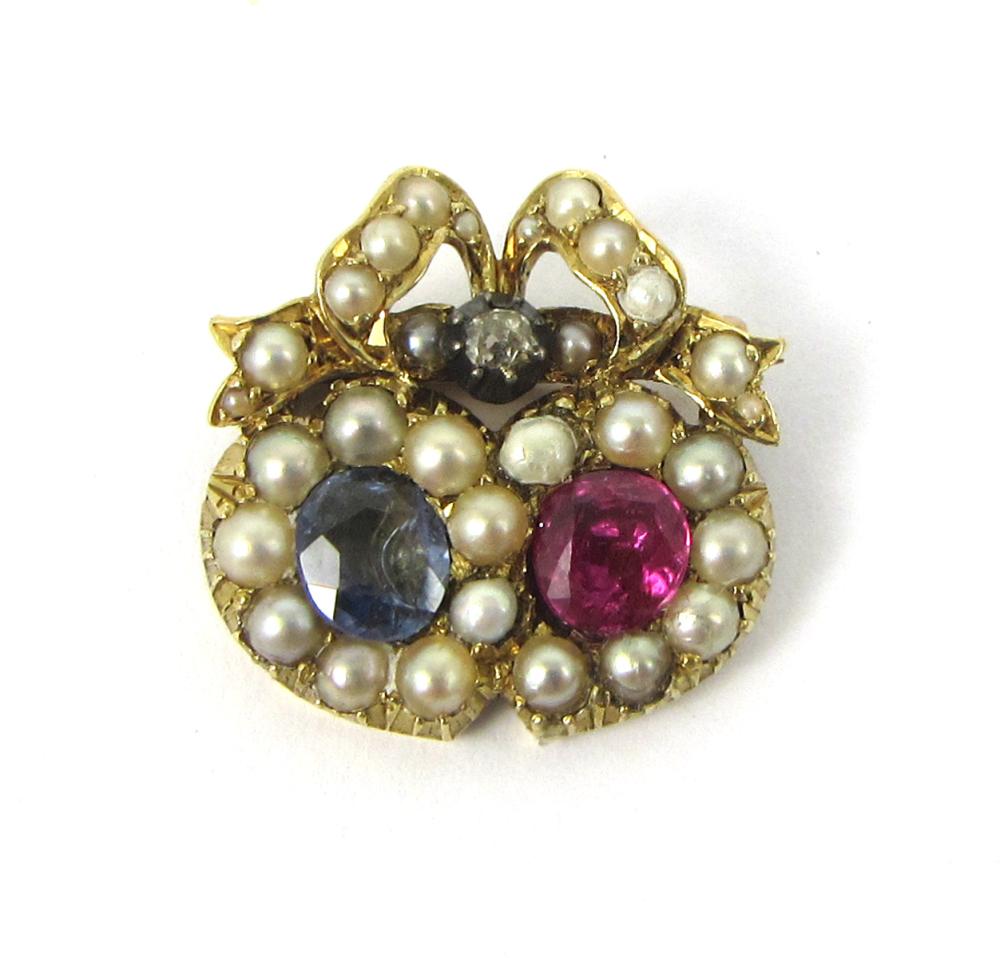 Appraisal: RUBY SAPPHIRE AND EIGHTEEN KARAT GOLD PENDANT BROOCH set with