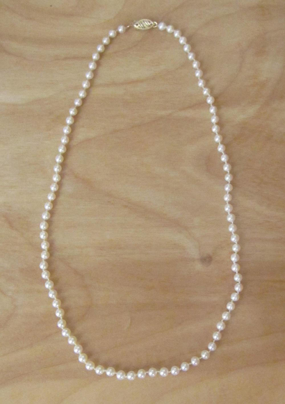 Appraisal: PRINCESS LENGTH PEARL AND FOURTEEN KARAT GOLD NECKLACE hand-knotted single