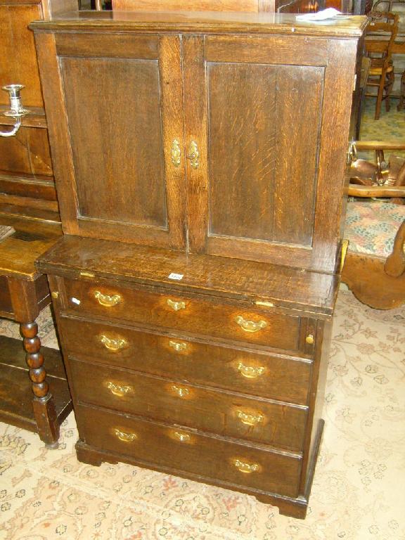 Appraisal: A small Georgian oak writing desk the base fitted with