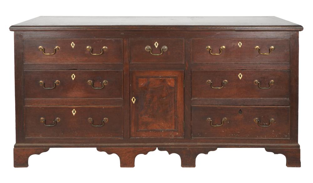 Appraisal: OAK WELSH DRESSER BASEhaving seven drawers surrounding a central inlaid