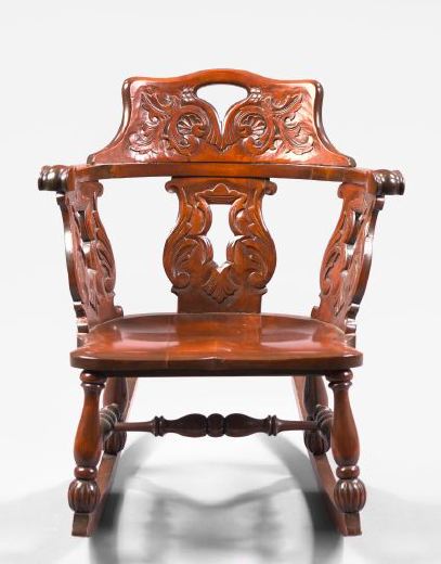 Appraisal: American Late Victorian Carved Mahogany Rocking Chair ca the back