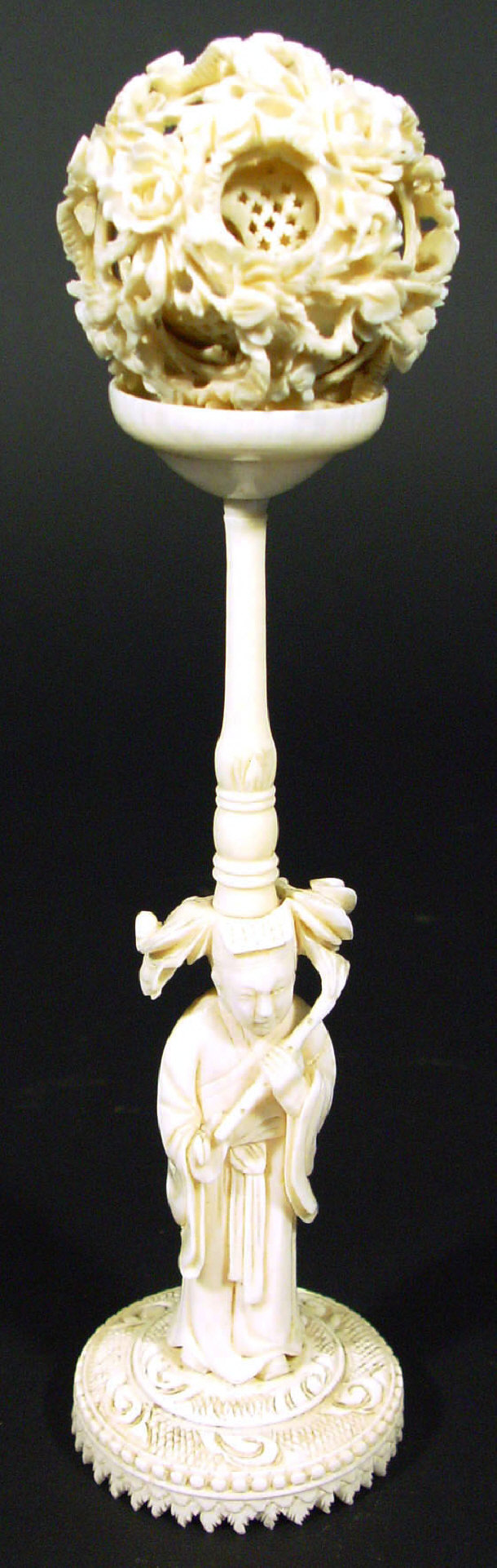 Appraisal: Chinese ivory floral carved puzzle ball on a figural stand