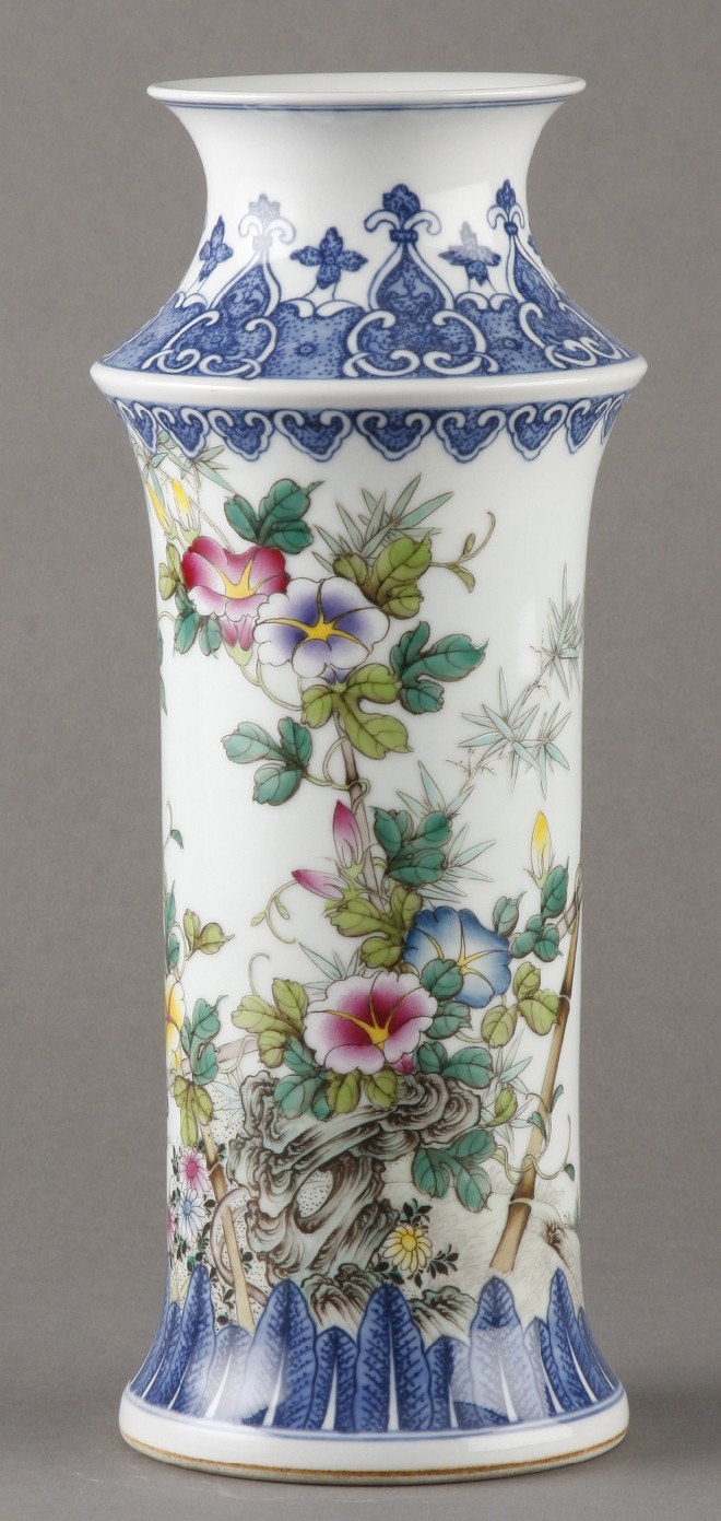 Appraisal: Tall vase features butterfly and flower motif on white ground