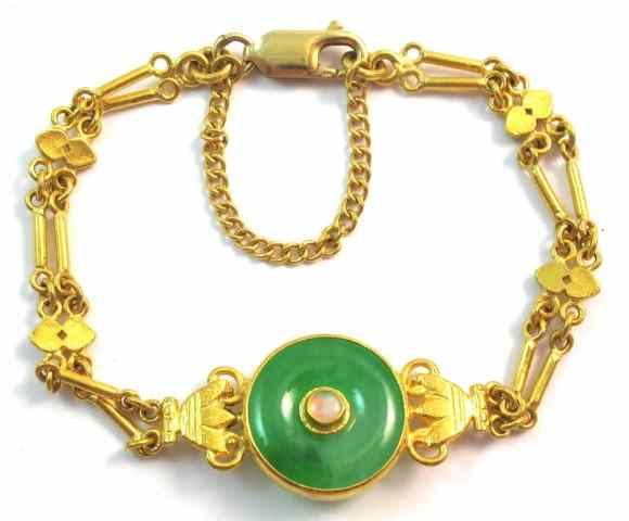 Appraisal: GREEN JADE AND OPAL BRACELET The k yellow gold bracelet