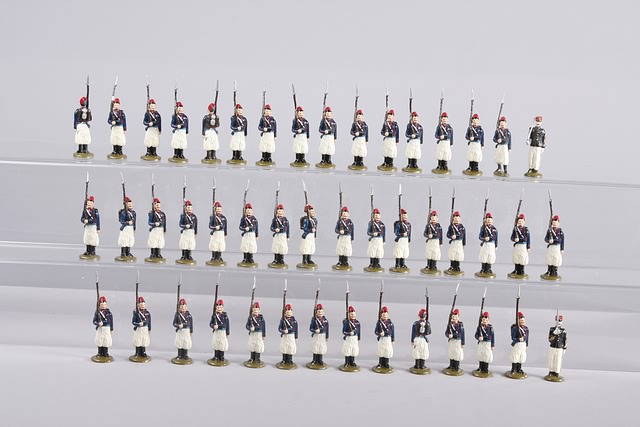 Appraisal: A similar lot of French Turcos with officers standing at