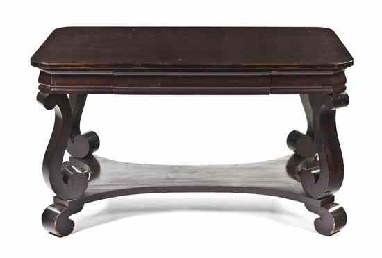 Appraisal: An Empire Style Mahogany Desk having a rectangular top over