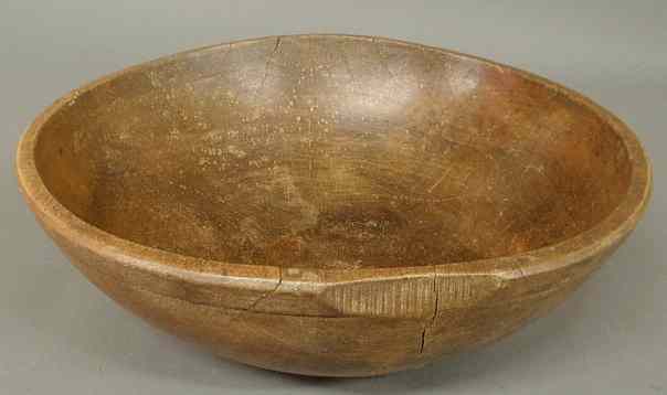 Appraisal: Large turned wooden bowl th c with a raised rim