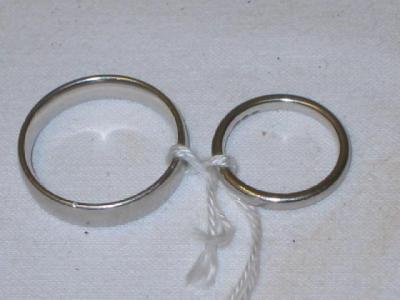 Appraisal: TWO PLATINUM BANDS sizes K and W g