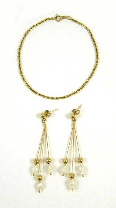 Appraisal: THREE ARTICLES OF FOURTEEN KARAT GOLD JEWELRY including a pair