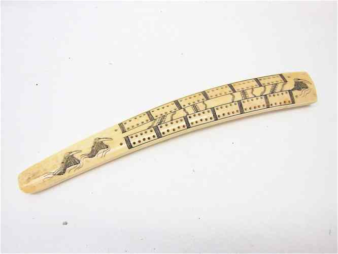 Appraisal: WALRUS IVORY CARVED CRIBBAGE BOARD c 's with scrimshawed walrus