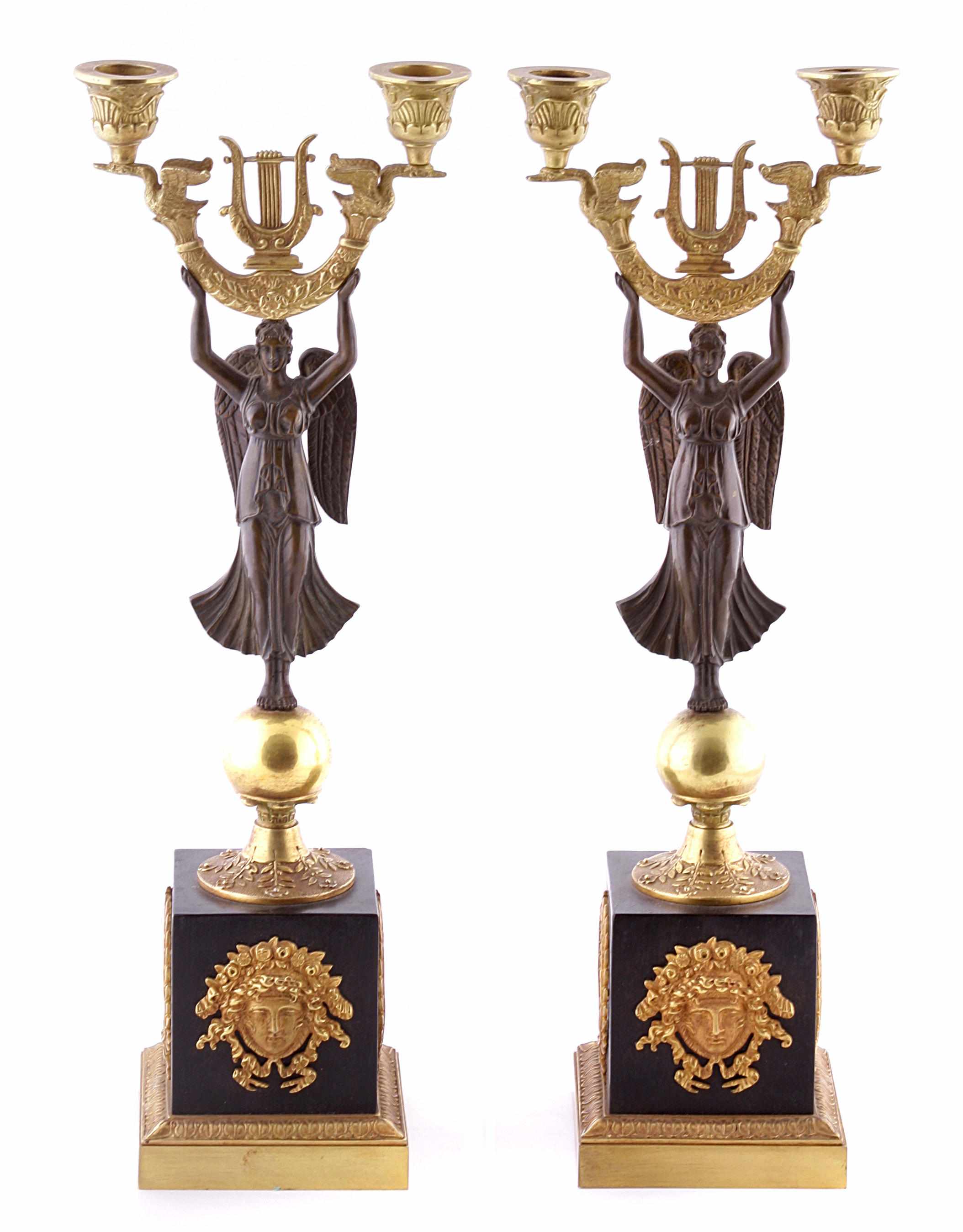 Appraisal: A pair of Empire style gilt and patinated bronze figural