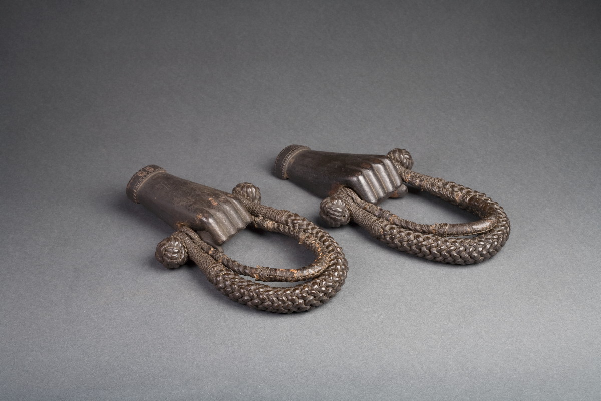 Appraisal: PAIR OF PAINTED WOVEN ROPE AND LEATHER BECKETS WITH CARVED