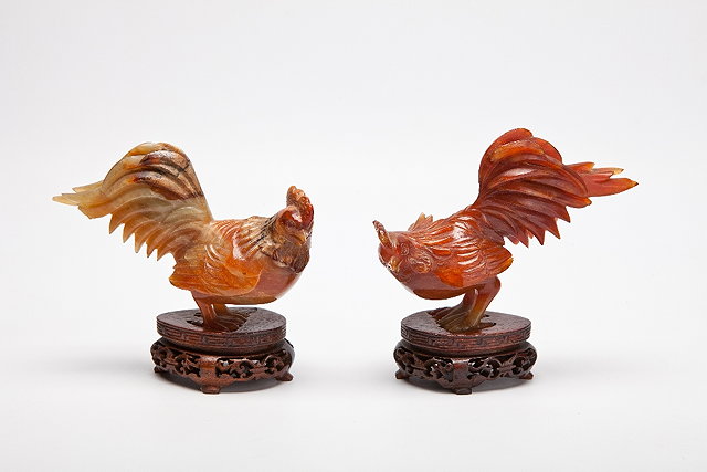 Appraisal: A CHINESE PAIR OF VARIEGATED RUSSET BROWN JADE COCKERELS on