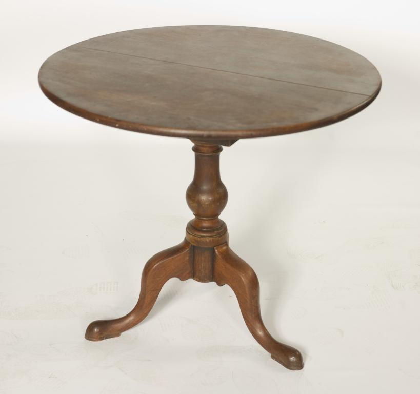 Appraisal: GEORGE III MAHOGANY TILT-TOP TRIPOD TABLE the circular top above