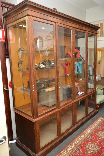 Appraisal: AN IMPRESSIVE EARLY TH CENTURY GLAZED DISPLAY SHOP CABINET WITH