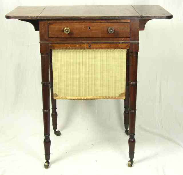 Appraisal: A th Century mahogany work table with two D shaped