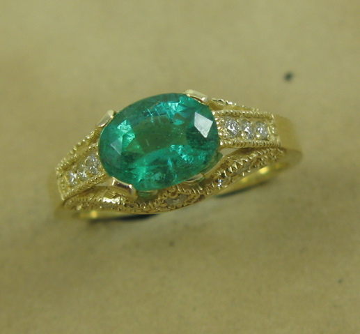 Appraisal: EMERALD DIAMOND AND FOURTEEN KARAT GOLD RING centered and prong