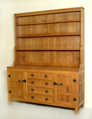 Appraisal: AN ADZED OAK DRESSER by Horace Knight en suite to