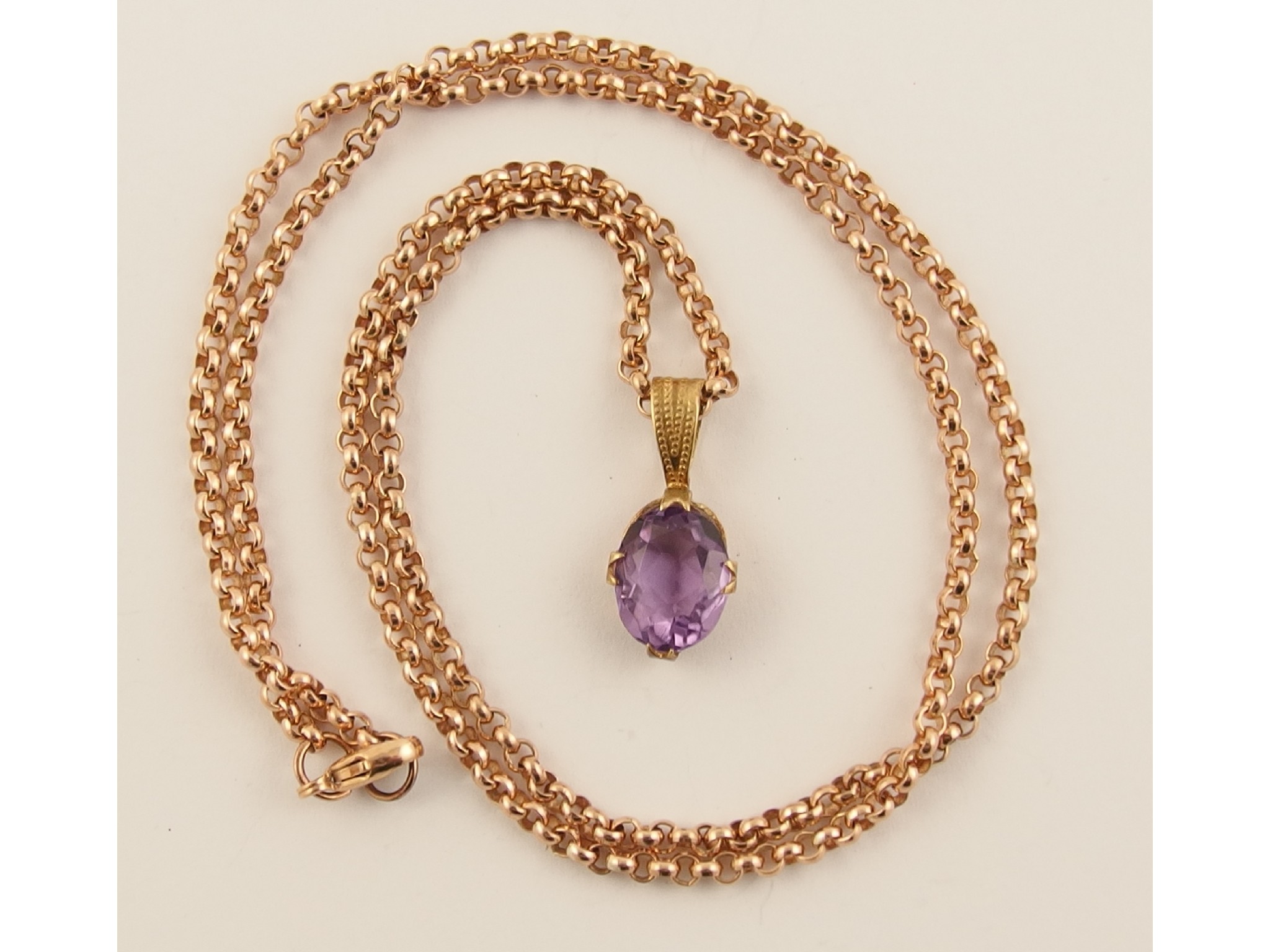 Appraisal: A ct rose gold chain with an amethyst pendant