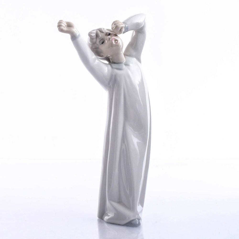 Appraisal: LLADRO FIGURINE BOY YAWNING Glazed sculpture of child yawning in