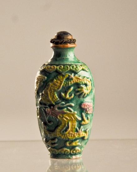 Appraisal: A th C Porcelain Snuff Bottle having a molded relief