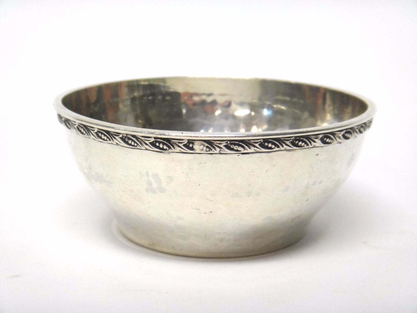 Appraisal: A silver bowl of circular form having a beaten finish