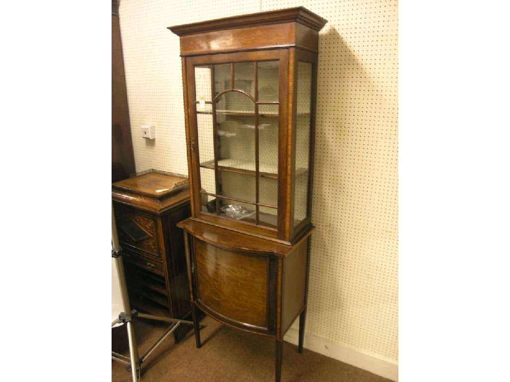 Appraisal: An Edwardian inlaid mahogany display cabinet the frieze inlaid with