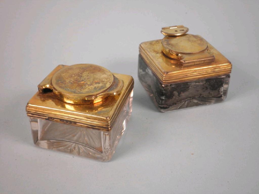 Appraisal: A pair of Victorian silver gilt inkwells each with cut