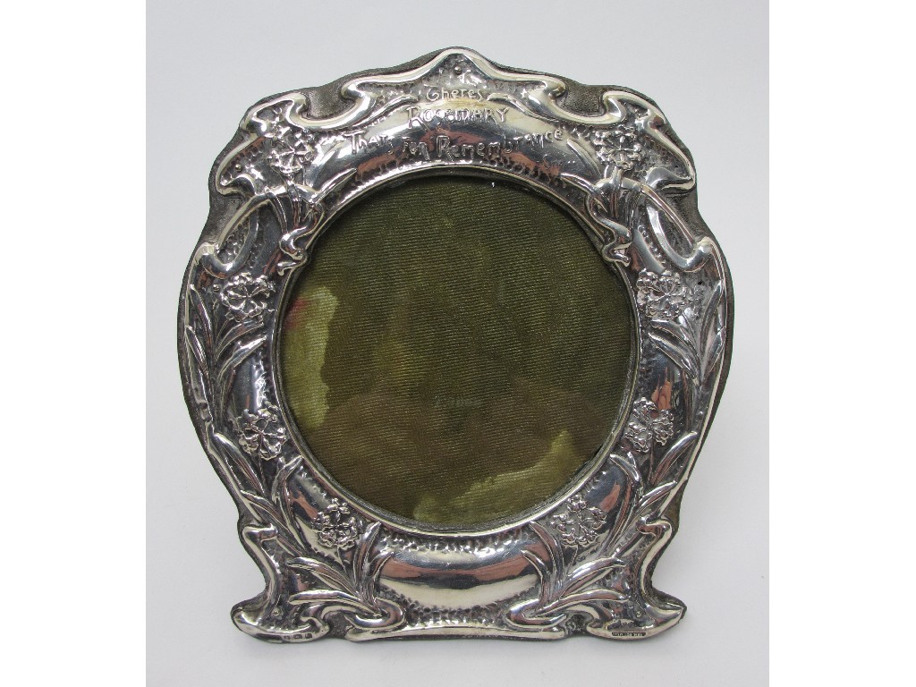 Appraisal: A silver mounted photograph frame embossed with fronds and flowers