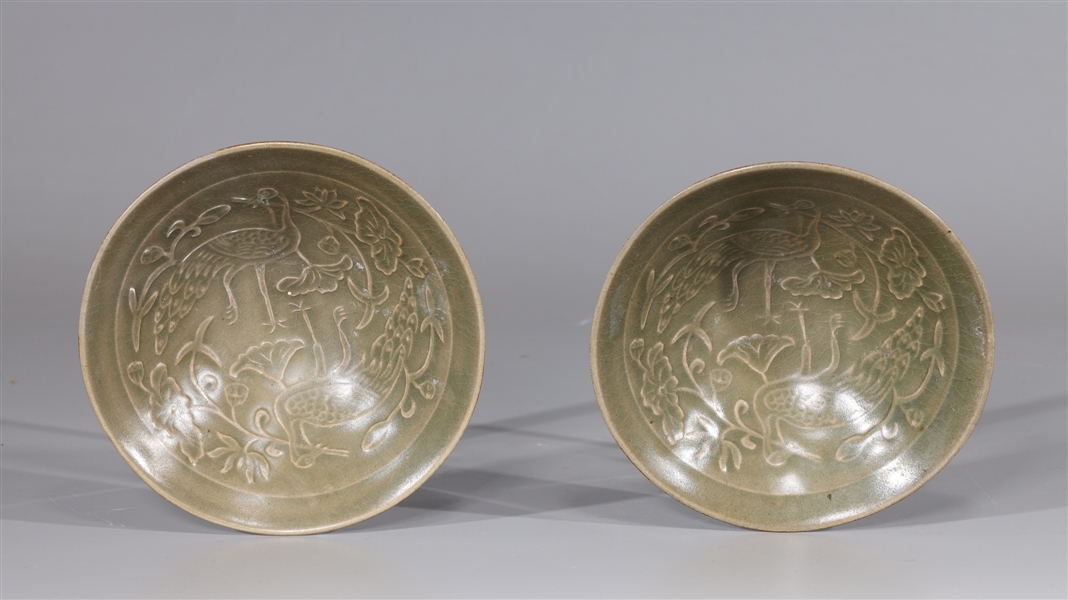 Appraisal: Pair of Chinese celadon glazed bowls with incised bird and