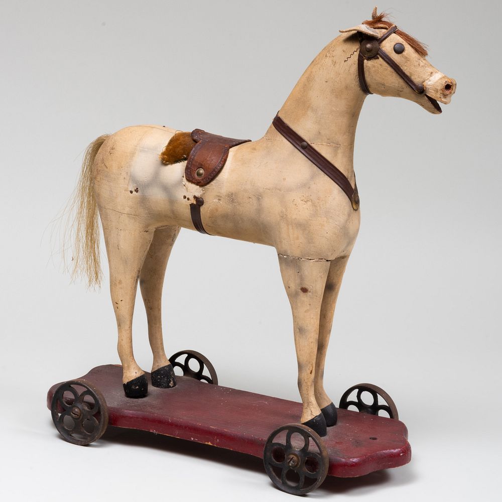 Appraisal: Painted Wood and Leather Horse Pull Toy Raised on wheels