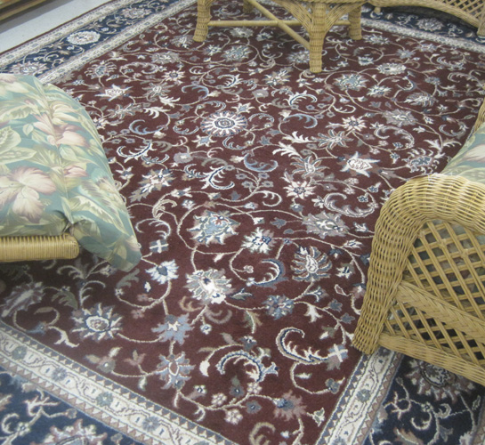 Appraisal: HAND KNOTTED ORIENTAL CARPET Indo-Persian Isfahan floral design on burgundy