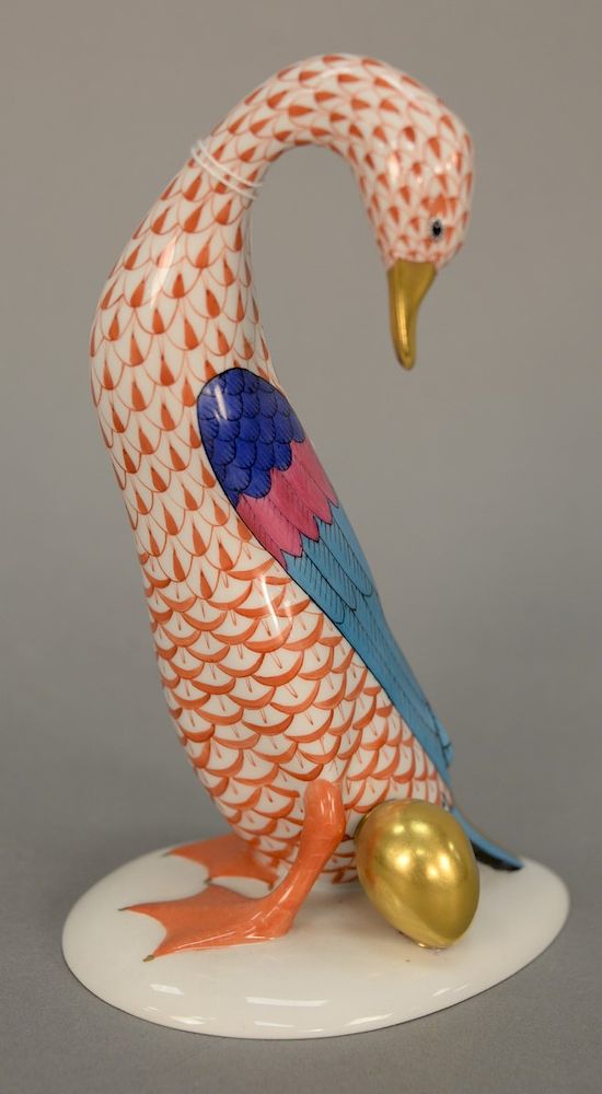 Appraisal: Herend porcelain duck with golden egg in orange fishnet Ht