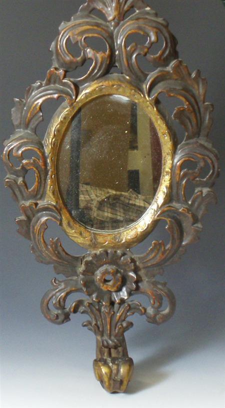 Appraisal: A th century North Italian rococo carved gilt wood mirror