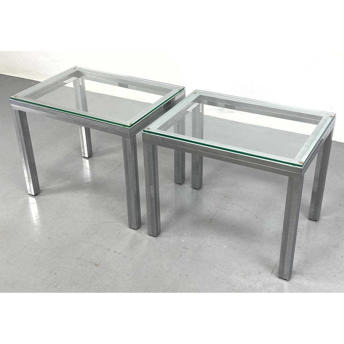 Appraisal: Pair of Heavy Paul Evans Style Chrome Glass Top Side