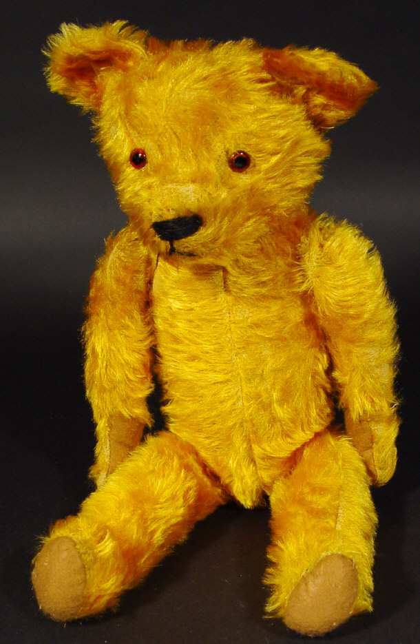 Appraisal: s straw filled golden teddy bear with jointed body and