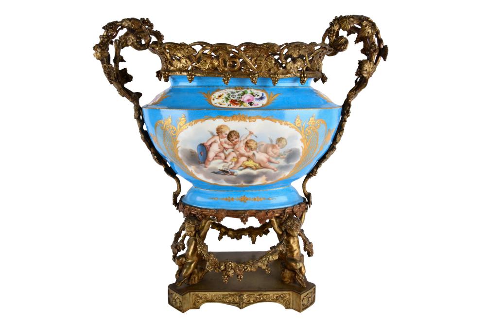 Appraisal: GILT BRONZE-MOUNTED SEVRES-STYLE PORCELAIN BOWLunmarked oval-shaped with pierced grapevine-cast rim