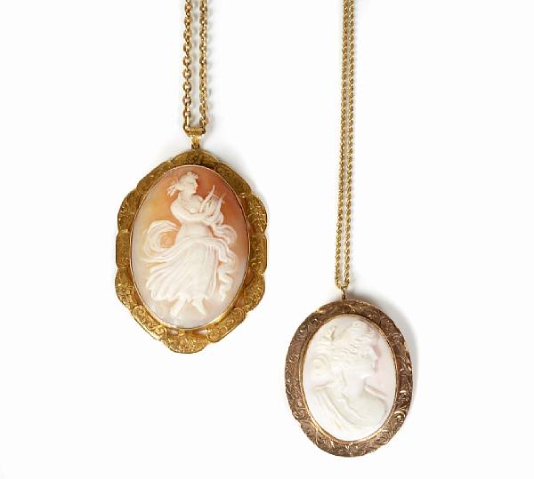 Appraisal: A pair of shell and gold cameo pendants with chains