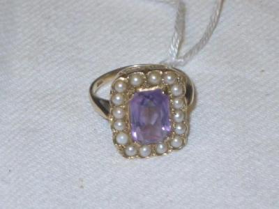 Appraisal: AN AMETHYST AND SEED PEARL RING of oblong form on