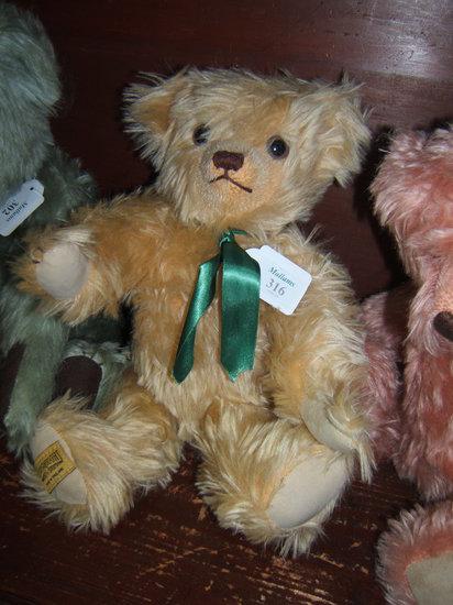 Appraisal: A Merry Thought mohair teddy bear with growler and green