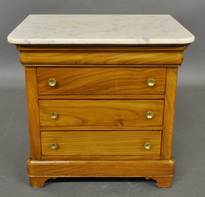 Appraisal: - Miniature French fruitwood marble top chest c h x