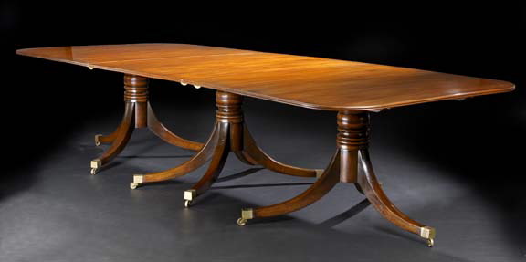 Appraisal: George III-Style Mahogany Dining Table the rounded rectangular top with