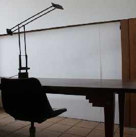 Appraisal: A Wooden Desk an Office Chair and a Tizio Lamp