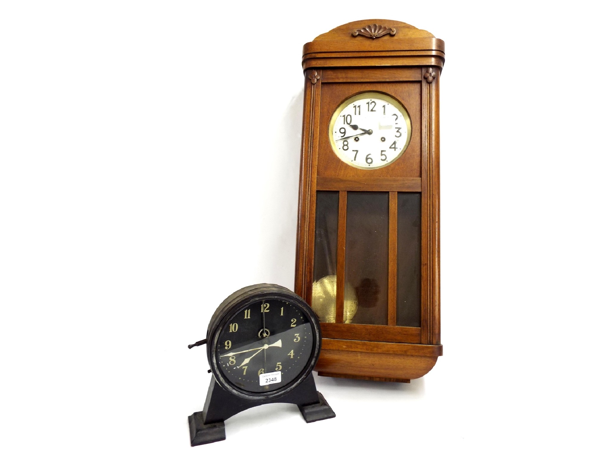 Appraisal: Interesting gravity shelf clock the dial behind a compound pendulum