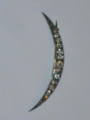 Appraisal: A VICTORIAN DIAMOND CRESCENT BROOCH the graduated diamonds set in