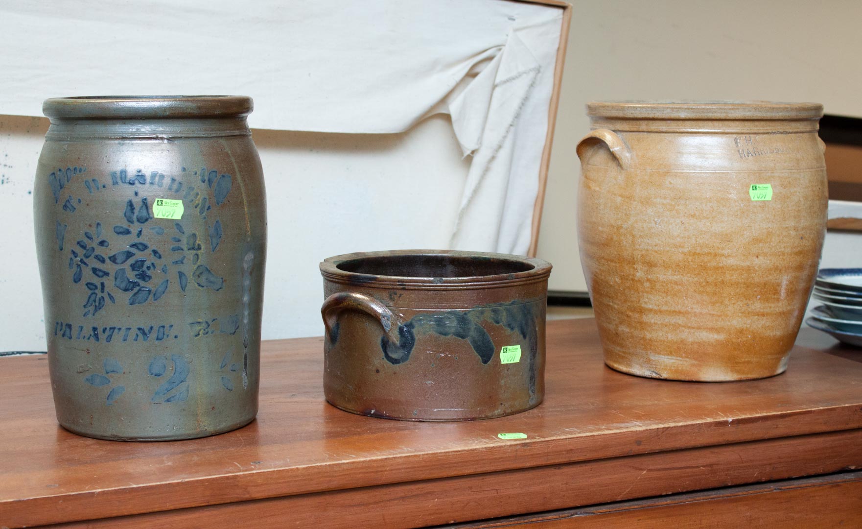 Appraisal: Three stoneware crocks including blue decorated butter crock large crock